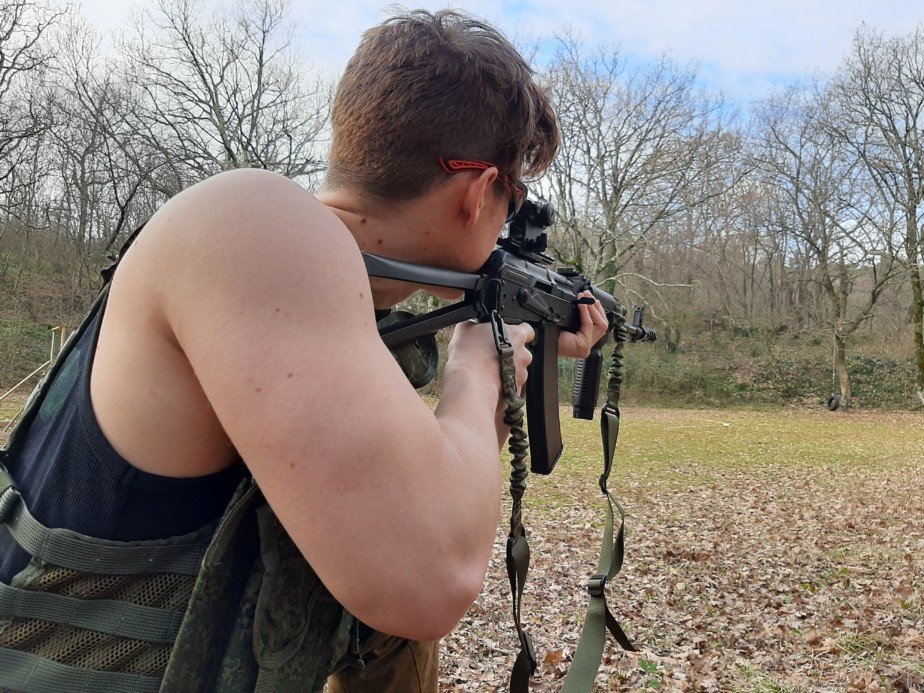 Man shooting his airsoft gun in his backyard