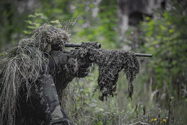 Airsoft sniper sniping down the target